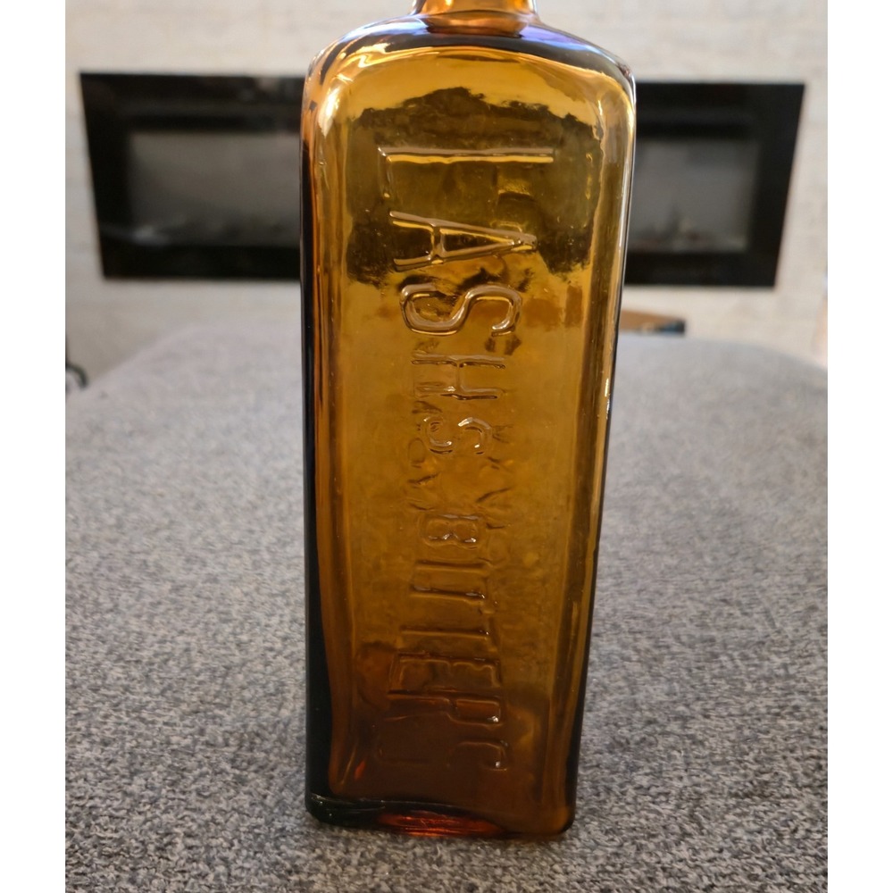 Antique Lash's Bitters Natural Tonic Laxative Amber Embossed Glass Bottle 1900's